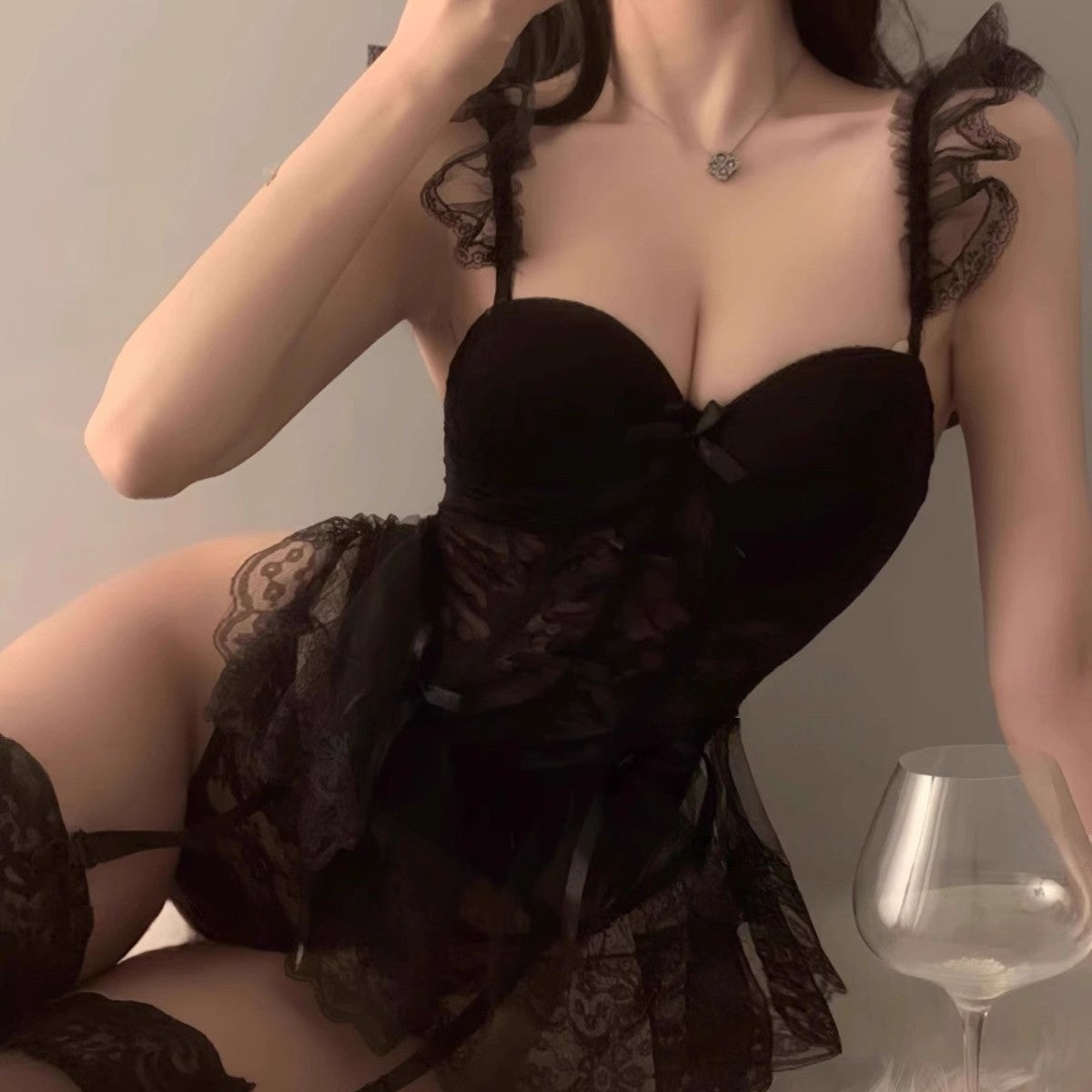 Closeup of delicate lace pattern on cherry pink corset bustier lingerie