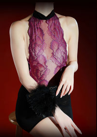 IOO&SILK plum lace halter one-piece, seated with a black feathered fan across the lap thumbnail