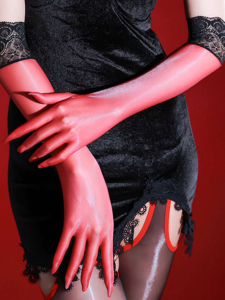 Red opera-length sheer gloves with black lace cuffs, hands crossed over a black mini dress